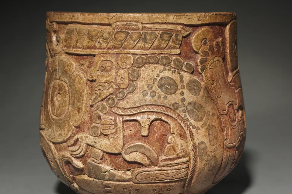 Carved Maya Chochola-style vessel depicting God L, the underworld deity linked to tobacco