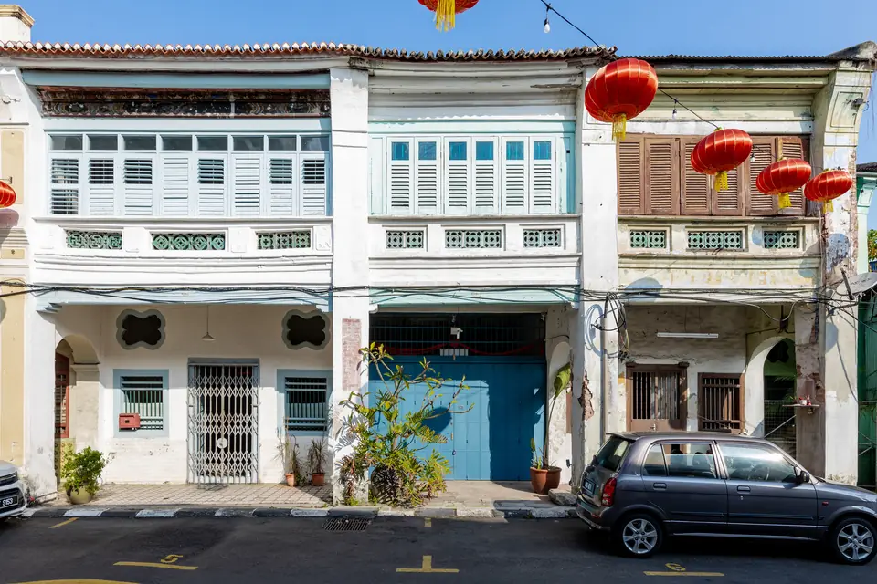 Cigar Shop Penang: George Town Rules and What We Could Verify — row of colonial-era heritage shophouses with red lanterns in George Town, Penang